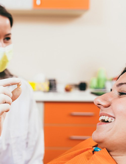 A dentist and patient talking about tooth extractions