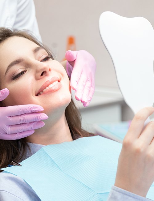a patient smiling after receiving dental treatment