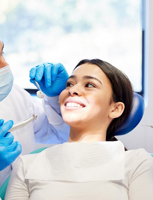 a patient visiting her dentist to receive a filling