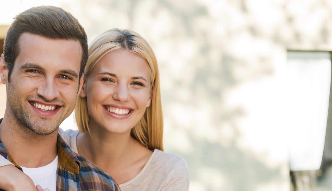 Man and woman with healthy smiles after visiting the dentist in Taylor Texas