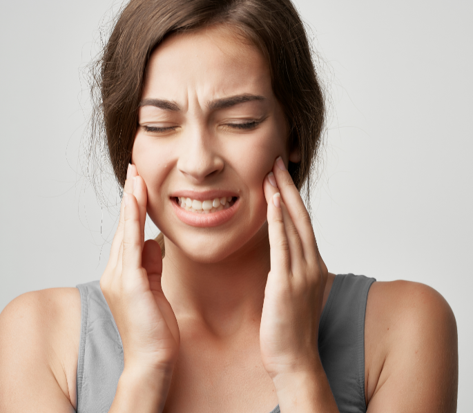 Woman holding jaw